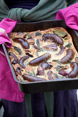 Toad-in-the-hole with sage and red onions