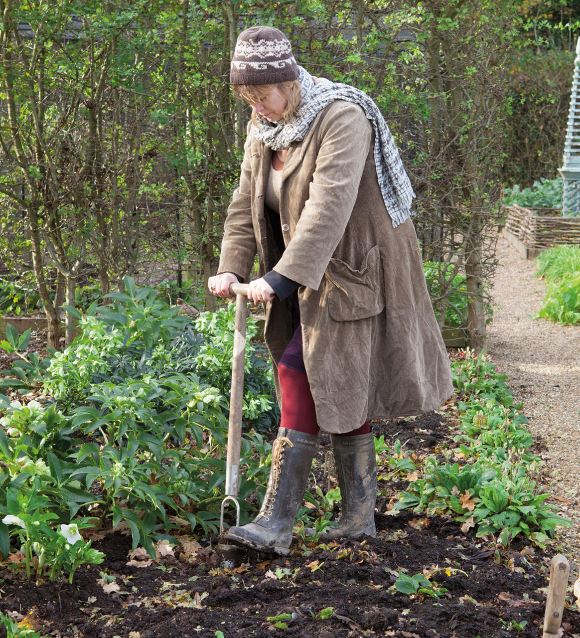 Sarah digging holes to plant bulbs